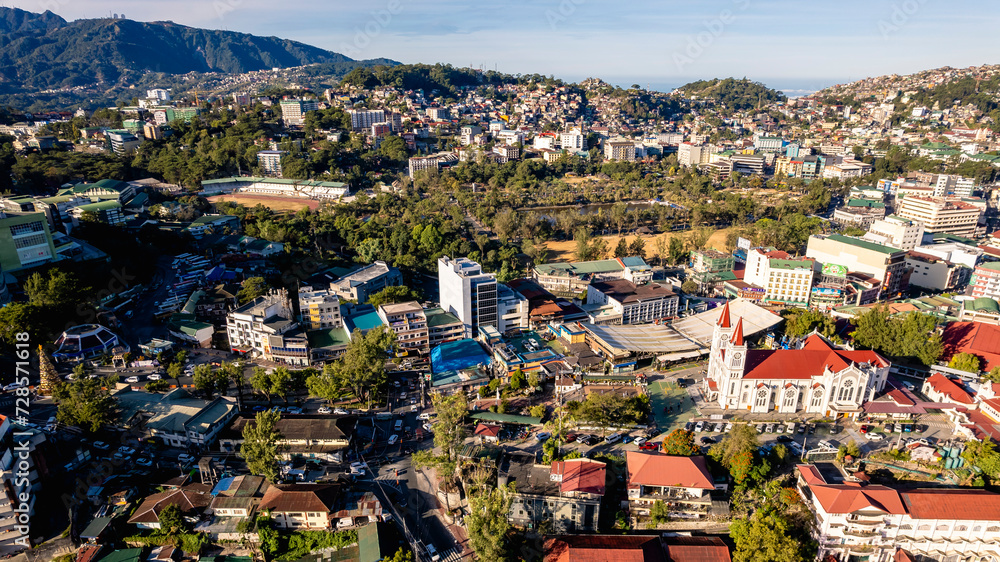 Baguio City, Philippines - Jan 16, 2024: Aerial of downtown Baguio, Burnham Park and the surrounding moutains.