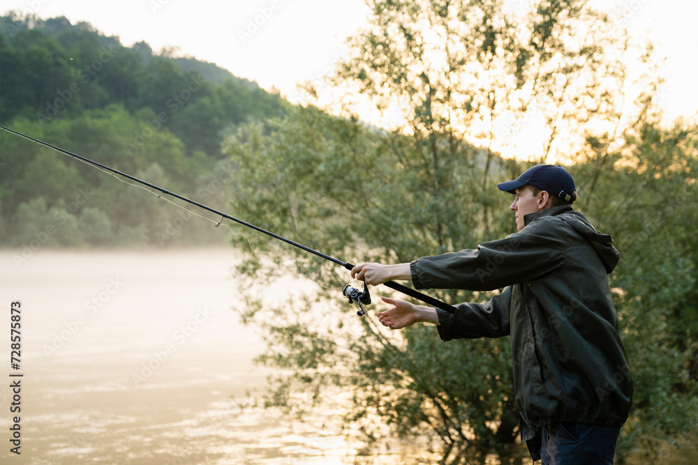 Man fishing on the mountain river at evening. Man fishing on the mountain river at evening.