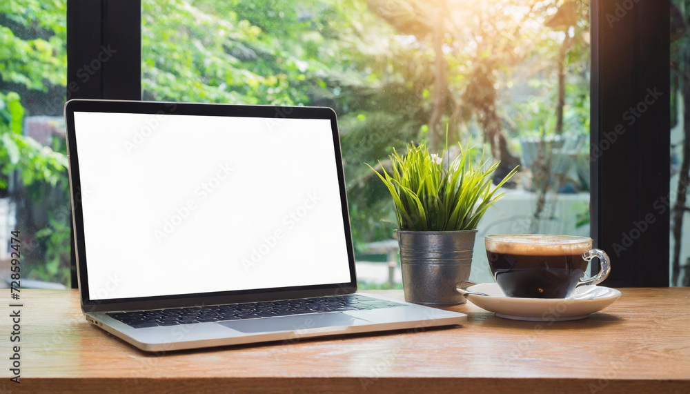 Desk Laptop with blank screen on table of coffee Desk Laptop with blank screen on table of coffee