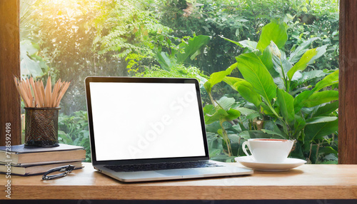 Desk Laptop with blank screen on table of coffee