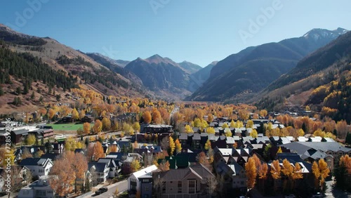 Low to high pullback drone shot revealing the city of Telluride, CO photo