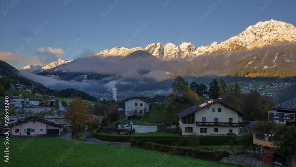 Timelapse Stubai Village chalet Tyrol Austria Austrian Alps first light golden morning sunrise first fresh snow on peaks clouds fog lifting autumn winter Christmas Innsbruck chalet landscape view Timelapse Stubai Village chalet Tyrol Austria Austrian Alps first light golden morning sunrise first fresh snow on peaks clouds fog lifting autumn winter Christmas Innsbruck chalet landscape view
