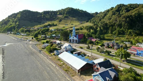 Aerial view of the dolly in Tenaun and its patrimonial church in the Chiloé Archipelago, southern Chile. photo