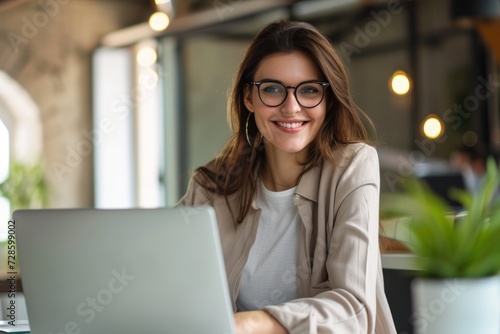 Woman Sitting in Front of Laptop Computer