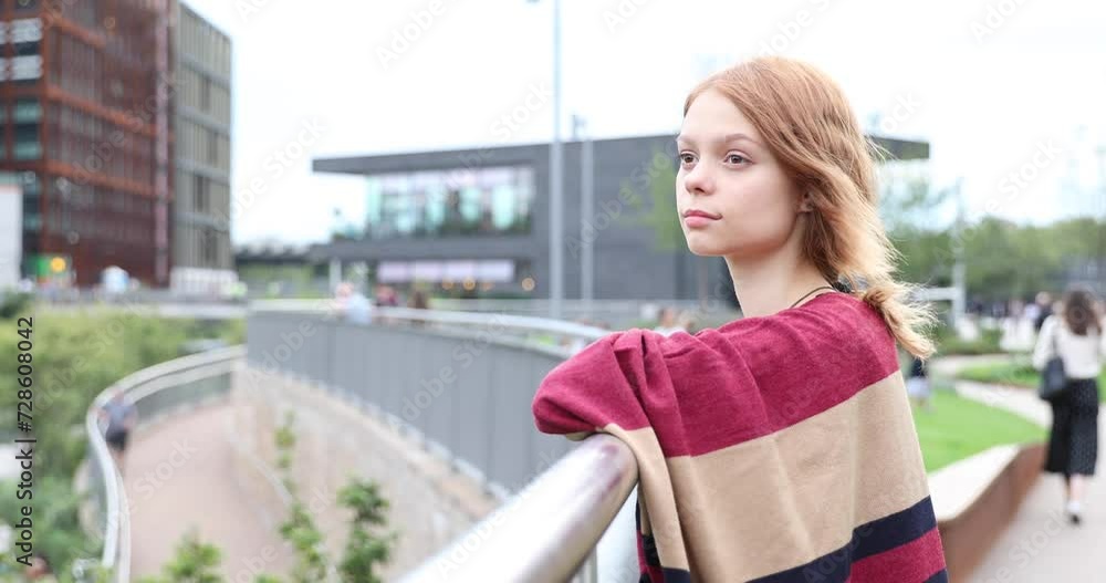 Authentic shot of a pensive sad young woman in the city Authentic shot of a pensive sad young woman in the city