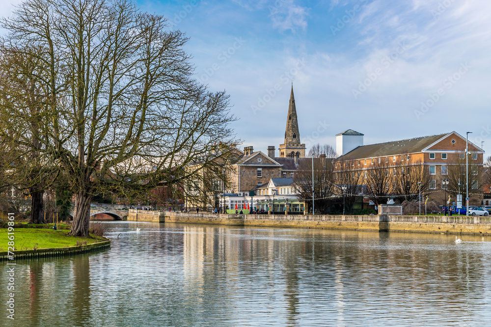 A view up the River Great Ouse towards the centre of Bedford, UK on a bright sunny day