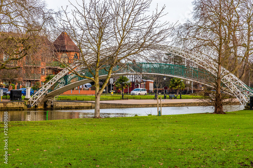 A view towards the Suspension Bridge from the island on River Great Ouse in Bedford, UK on a bright sunny day