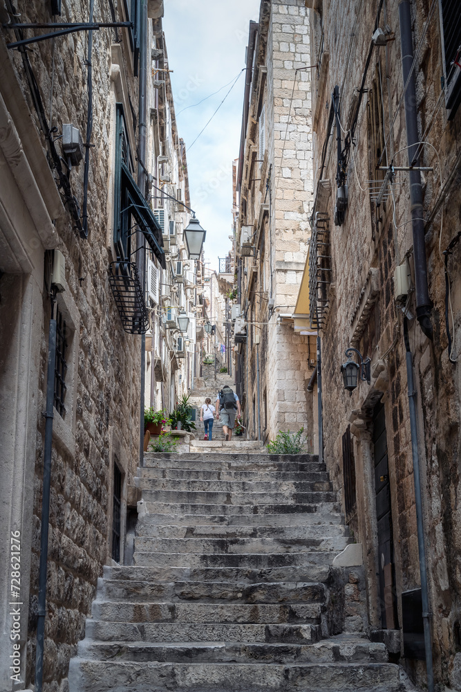 Narrow and steep alley with stone steps in the center of the old town of Dubrovnik, Croatia