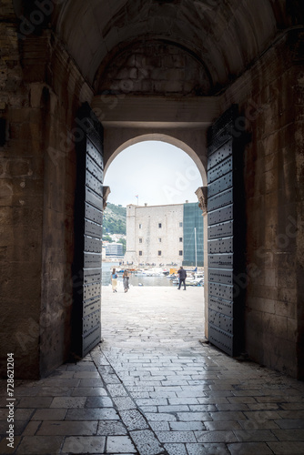 View through one of the exits of the old town of Dubrovnik towards the harbor, Croatia