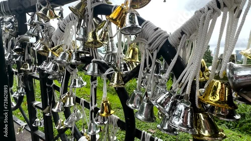Wishing Bells On Railing At Mount Faber Park In Singapore. closeup shot photo