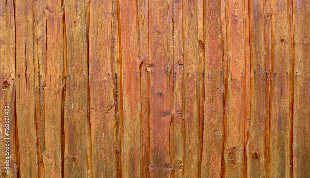 Fototapeta premium Brown wood texture background coming from natural tree. The wooden panel has a beautiful dark pattern, hardwood floor texture