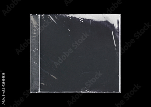 CD disk video case on black background. Isolated music transparent mockup. Clean cover box template. photo