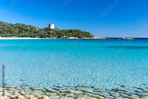 Cala Pira beach and tower, with white sand and crystal clear water. Castiadas, Sardinia, Italy photo