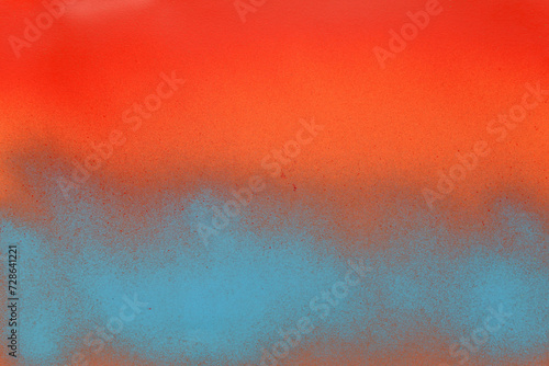 red and blue spray paint on a orange color paper background