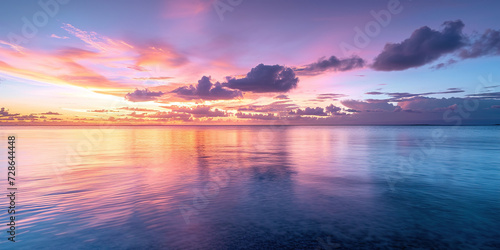 Calm Sea sunset landscape. Purple  pink  orange fiery golden hour evening sky in the horizon. Mindfulness  meditation  calmness  serenity  relaxation concept wallpaper background