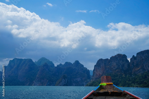 Boat with Cheow Lan Lake (Rajjaprabha Dam Reservoir) in Khao Sok National Park in Surat Thani Province, Thailand.