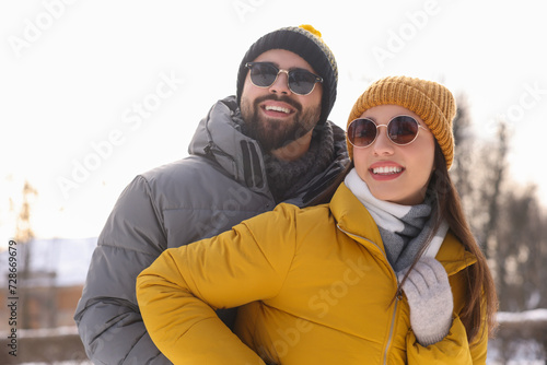 Beautiful happy couple spending time together on winter day