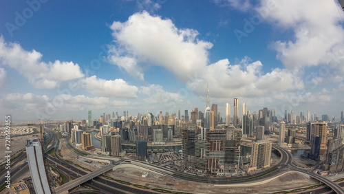 Fototapeta Naklejka Na Ścianę i Meble -  Panoramic skyline of Dubai with business bay and downtown district night to day timelapse.