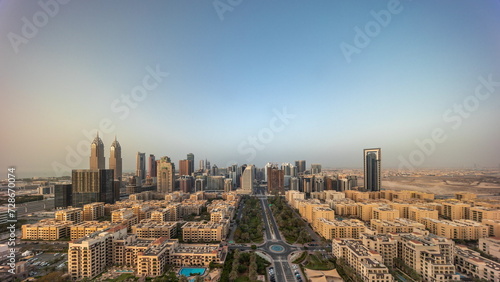 Panorama of skyscrapers in Barsha Heights district and low rise buildings in Greens district aerial all day timelapse. © neiezhmakov