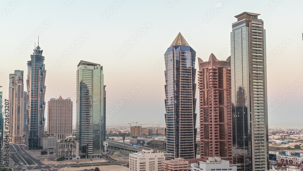 Business bay district skyline with modern architecture night to day timelapse from above.