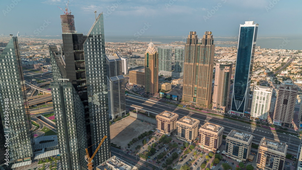 High-rise buildings on Sheikh Zayed Road in Dubai aerial morning timelapse, UAE.