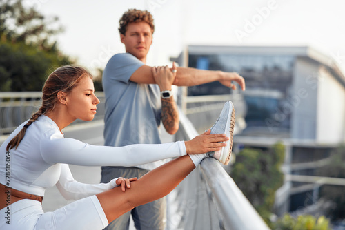 Young couple doing sports outdoors