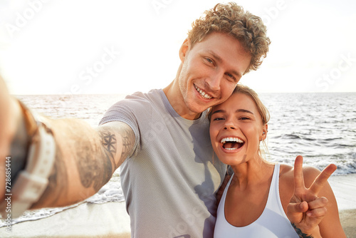 Young couple doing sports outdoors photo