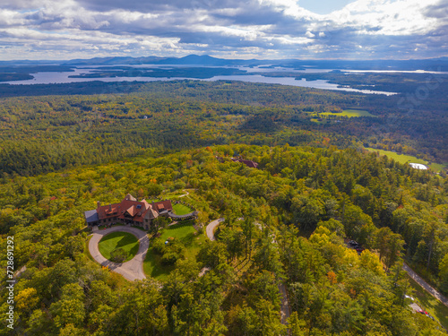 Castle in the Clouds aka Lucknow mansion aerial view in fall at the top of Lee Mountain with Lake Winnipesaukee and Ossipee Mountains at the background in town of Moultonborough, New Hampshire NH, USA photo