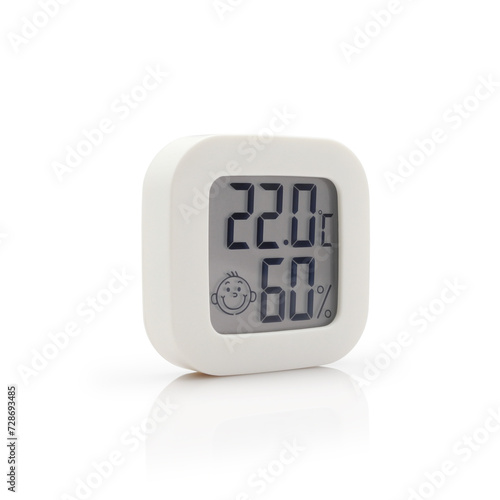 Minimalistic digital household thermometer and hygrometer displaying healthy indoor temperature and humidity. Isolated on white background.   photo