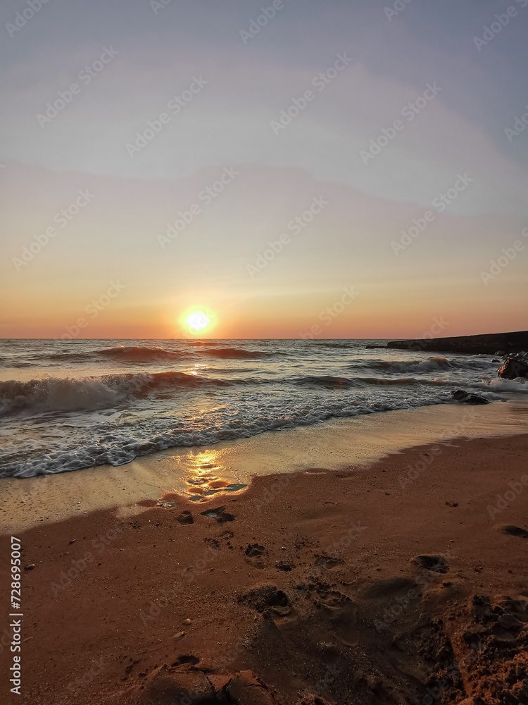 Tranquil Evening Seascape, Summer Sunset Casting Warm Glow Over Calm Waters with Clouds, Serene Beauty of Dusk