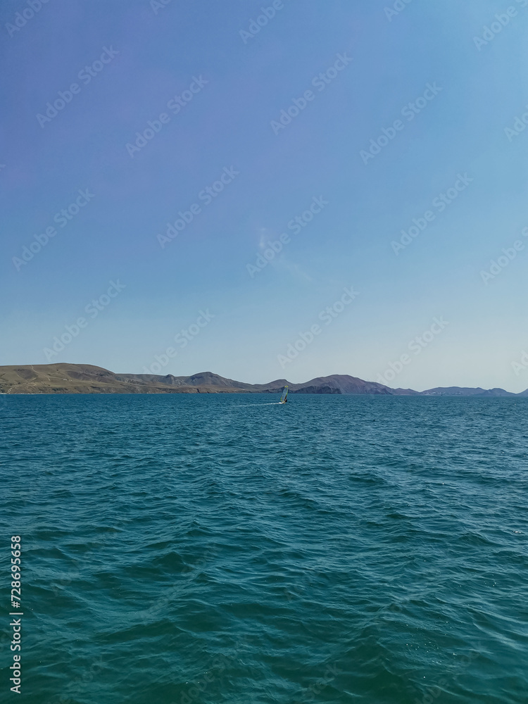 Sunny Summer Landscape of Sea, Mountains, and Sky with No People Sunny Summer Landscape of Sea, Mountains, and Sky with No People