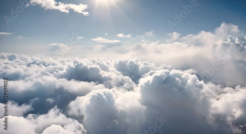 cielo azzurro con nuvole bianche, volo sopra le nuvole una giornata soleggiata con f vento photo
