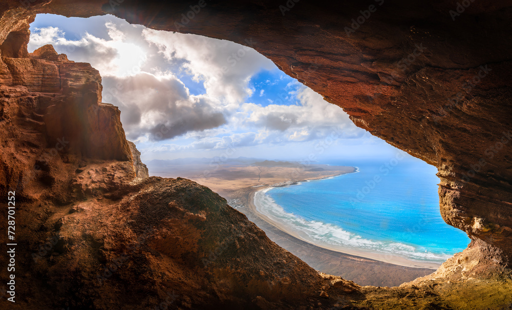 Unveil the beauty of Cueva De Los Suecos in Haría, Lanzarote, where majestic cliffs frame the serene Atlantic, a perfect fusion of geology and artistry.