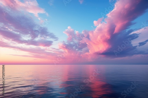 A large expanse of water stretches as far as the eye can see, reflecting the cloudy sky above.