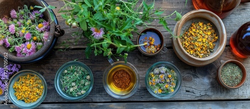 Arrangement of herbal elements on table  including tea and tincture.
