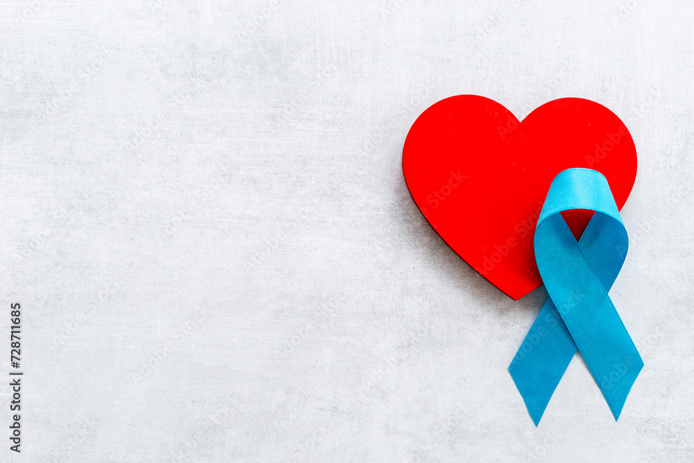 Blue ribbon with heart for world colon cancer day