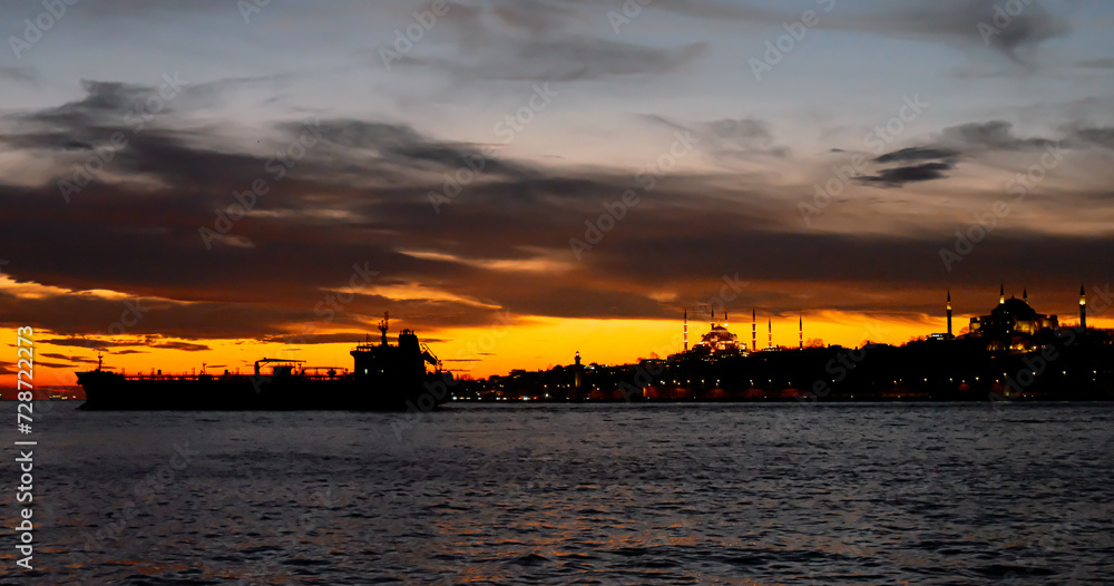 Big silhouette of cargo ship in the Marmara sea, Turkey. Coastline of Istanbul
