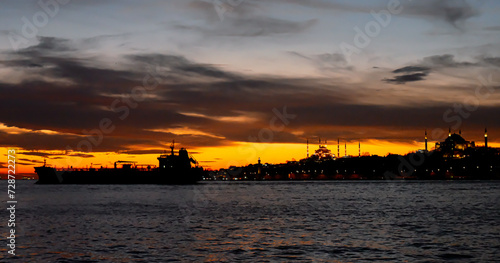 Big silhouette of cargo ship in the Marmara sea, Turkey. Coastline of Istanbul