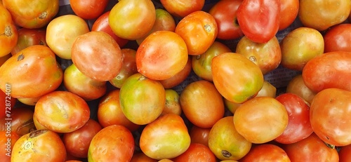 Pile of fresh tomatoes are used for ingredient cookery in Indonesia. Sold in local market