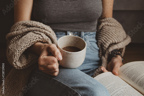 woman with book and cup of coffee