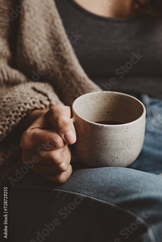 woman with book and cup of coffee