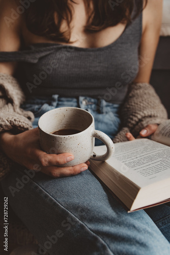 woman with book and cup of coffee