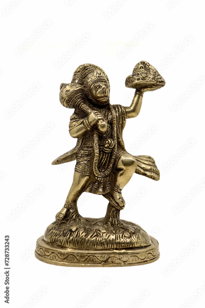 Naklejka premium antique handcrafted statue of lord hanuman carrying a mountain according to hindu scripture ramayan isolated in a white background 