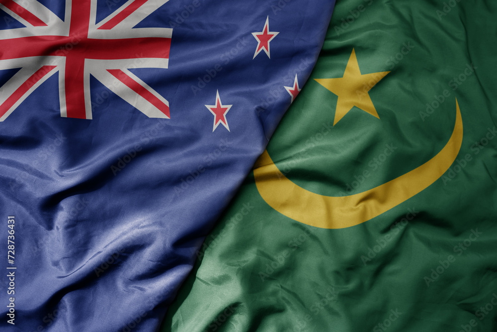big waving national colorful flag of mauritania and national flag of new zealand . big waving national colorful flag of mauritania and national flag of new zealand .