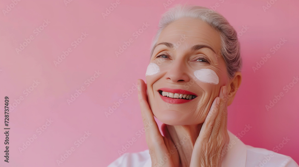 senior beautiful woman smile use cream for good skin. face of a healthy woman apply cream and makeup senior beautiful woman smile use cream for good skin. face of a healthy woman apply cream and makeup