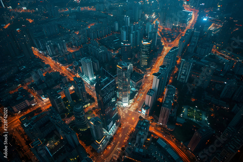 Aerial view of a bustling commercial district at twilight, city lights