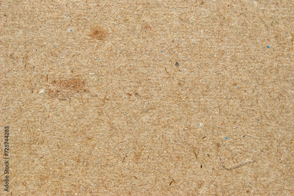 A sheet of brown recycled cardboard texture as background
A sheet of brown recycled cardboard texture as background