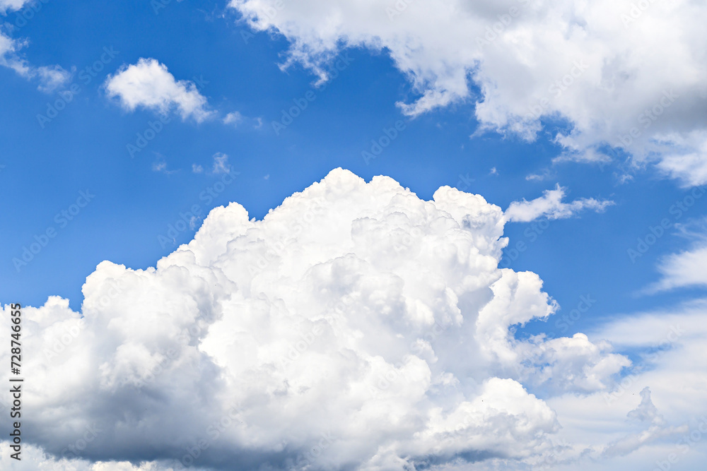 White clouds in a bright blue sky. The beauty of the nature White clouds in a bright blue sky. The beauty of the nature
