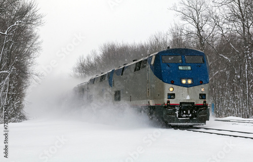 Amtrak passenger train barreling through an intense blizzard with the hopeful destination being Chicago, Illinois