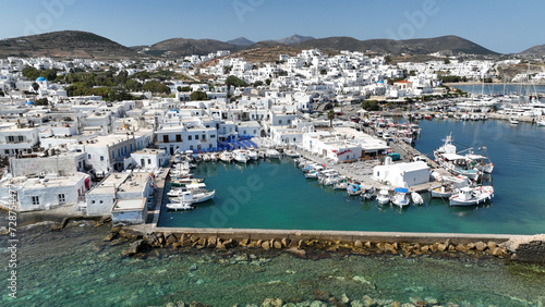 Fototapeta Naklejka Na Ścianę i Meble -  Aerial drone photo from picturesque small seaside village of Naoussa with traditional Cycladic character, Paros island, Cyclades, Greece